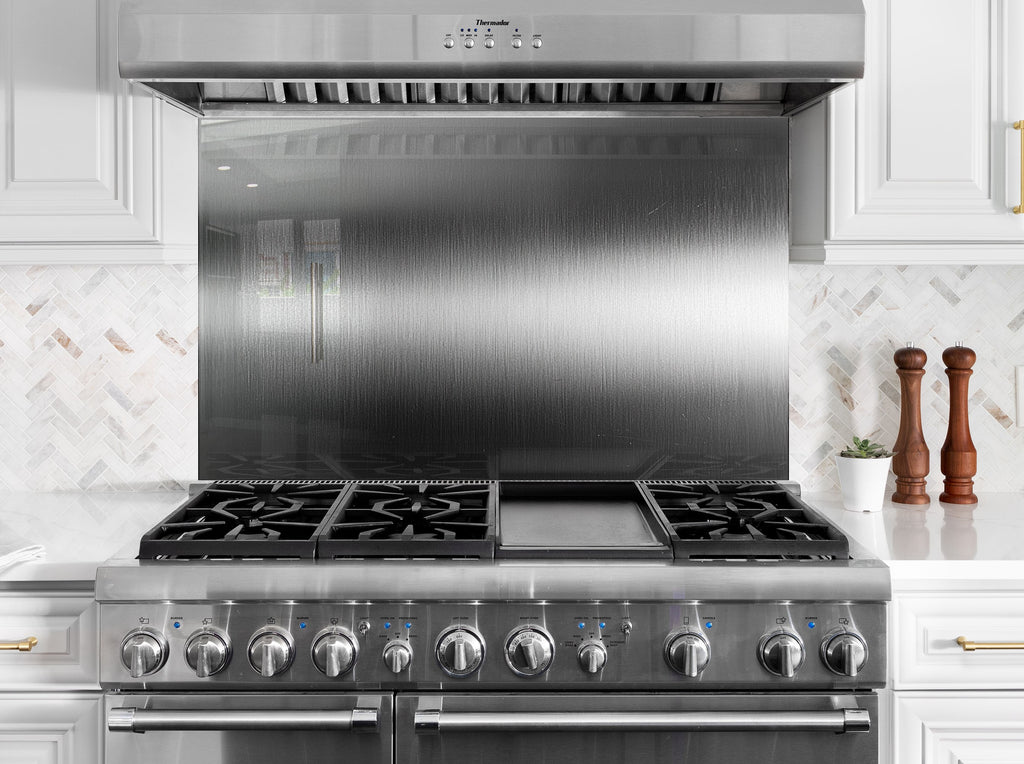 Modern stainless steel-inspired backsplash glass for luxury minimalist kitchens.

