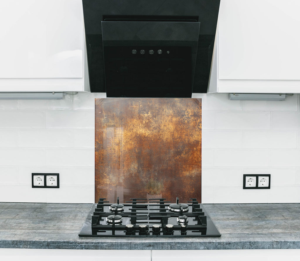 Modern industrial backsplash glass with rich rust tones and weathered metal look.

