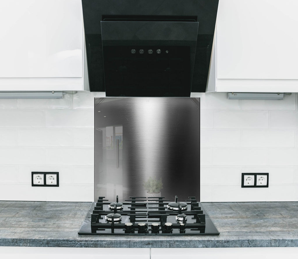 Backsplash glass with sleek brushed steel texture perfect for contemporary kitchen design.

