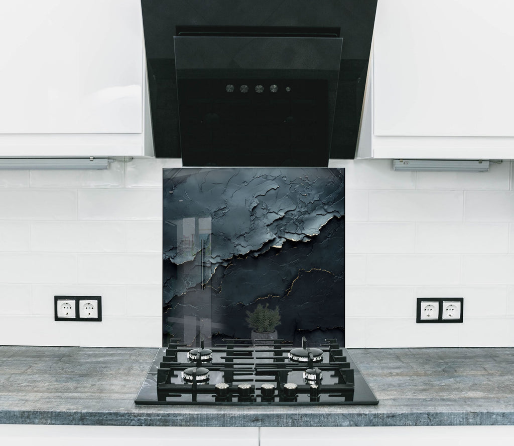 Backsplash glass art with dramatic black cracked texture and subtle gold accents, perfect for luxurious modern kitchens.

