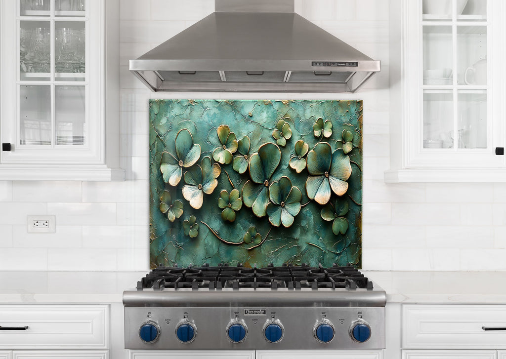 Textured green floral glass kitchen backsplash with golden accents – nature-inspired charm.

