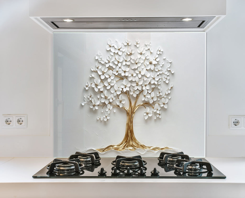 Sleek and modern glass backsplash featuring a pearl-white floral tree with golden roots.

