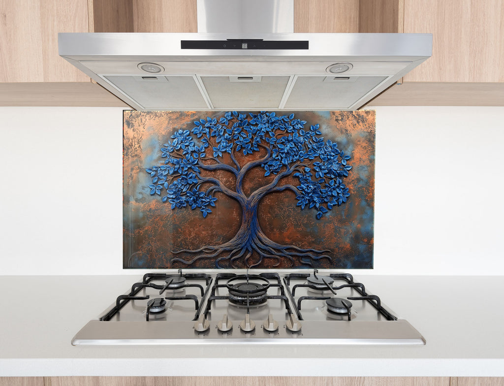 Elegant bronze and cobalt tree design on glass backsplash – perfect for statement kitchens.


