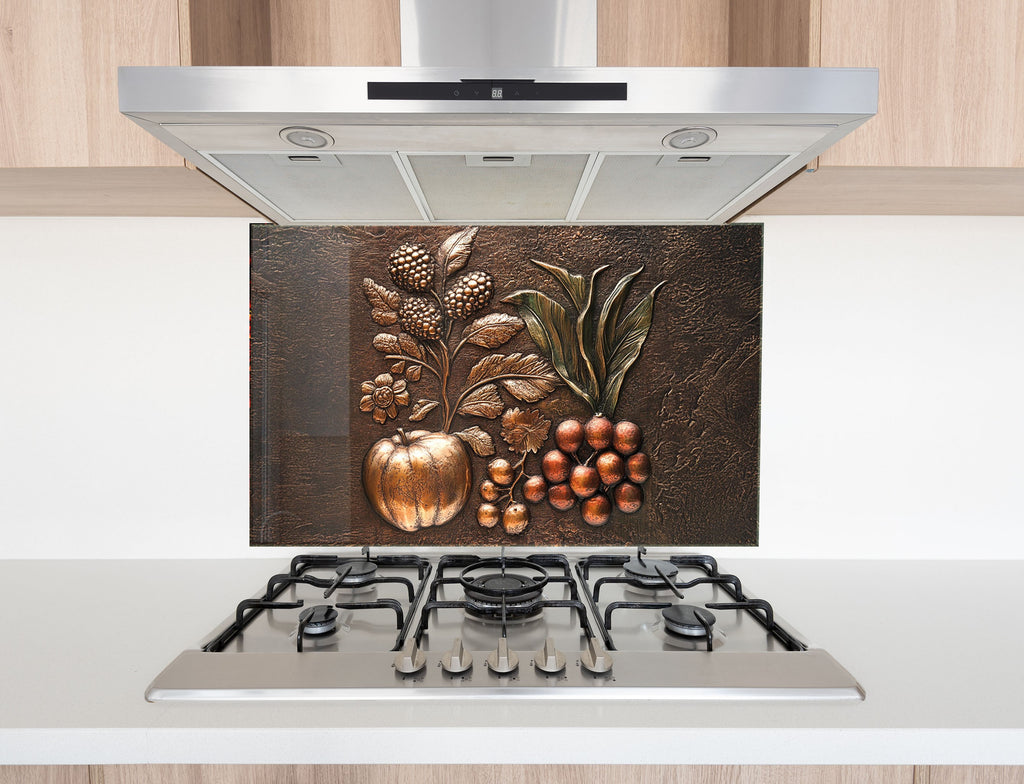 Antique bronze fruit relief glass kitchen backsplash – rustic elegance for classic interiors.

