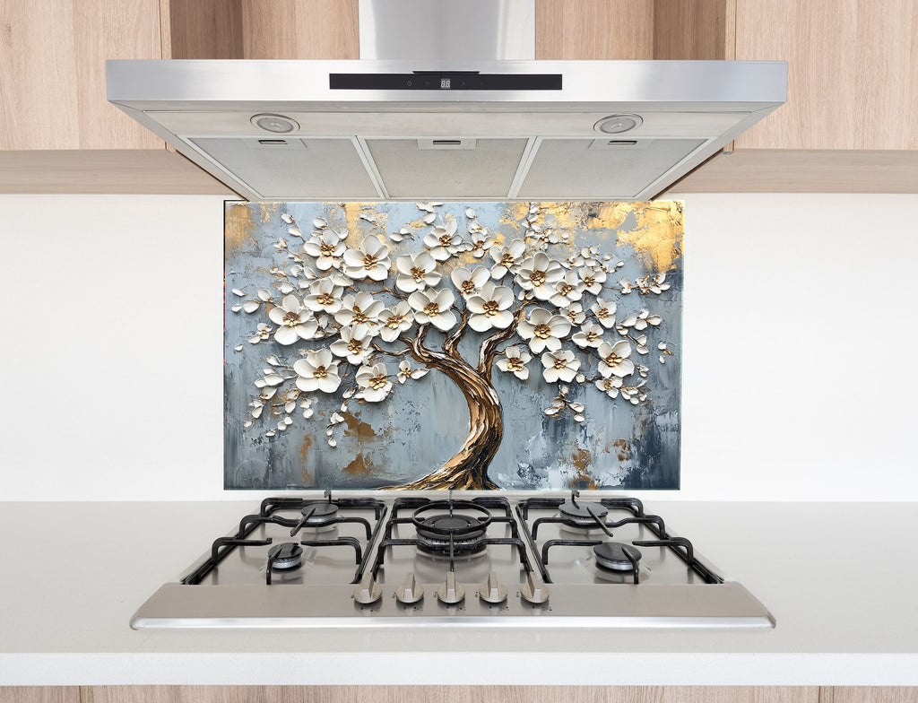 Luxurious glass backsplash with blooming tree design – graceful and radiant kitchen art.

