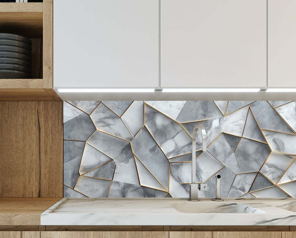 Gray and gold glass kitchen backsplash with angular marble forms – striking and refined.

