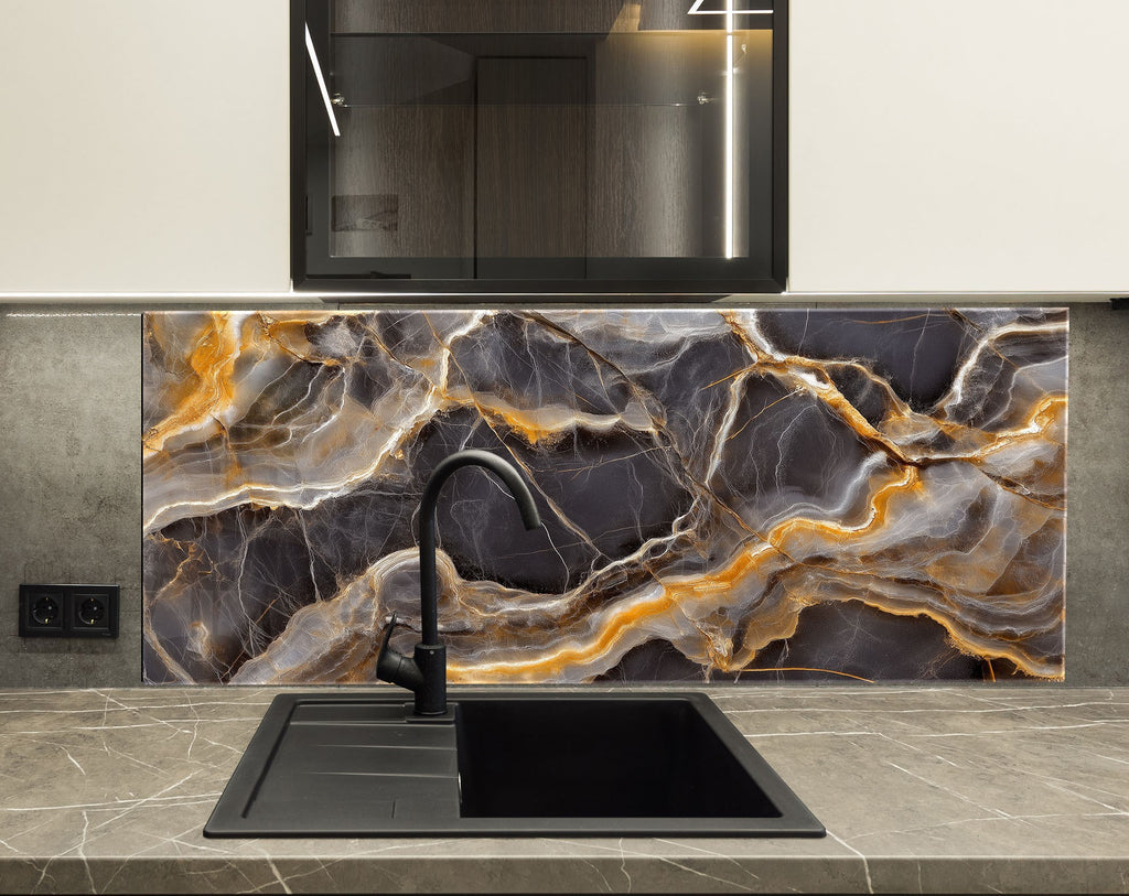 Dramatic dark stone-style glass backsplash featuring molten gold-like lines.


