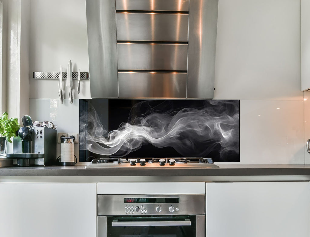 a stove top oven sitting inside of a kitchen