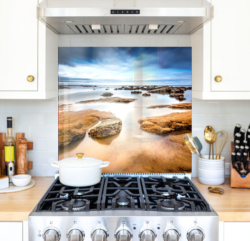 a stove top oven sitting inside of a kitchen