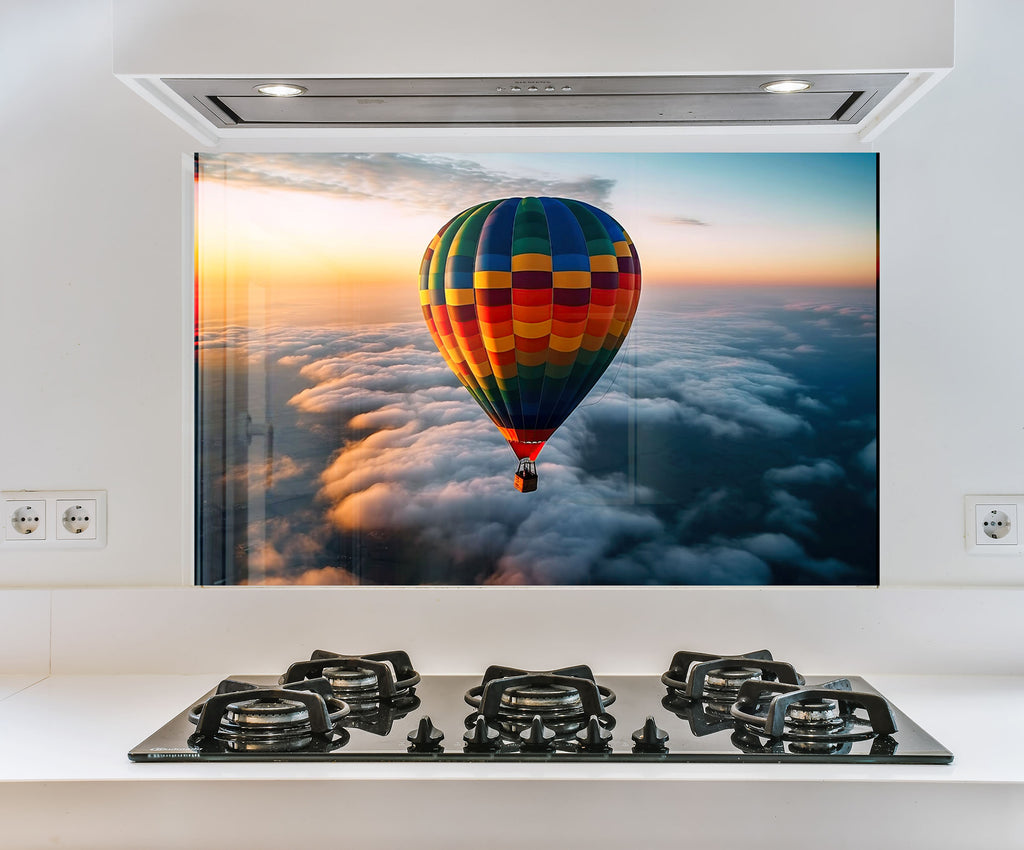 a picture of a hot air balloon above the clouds
