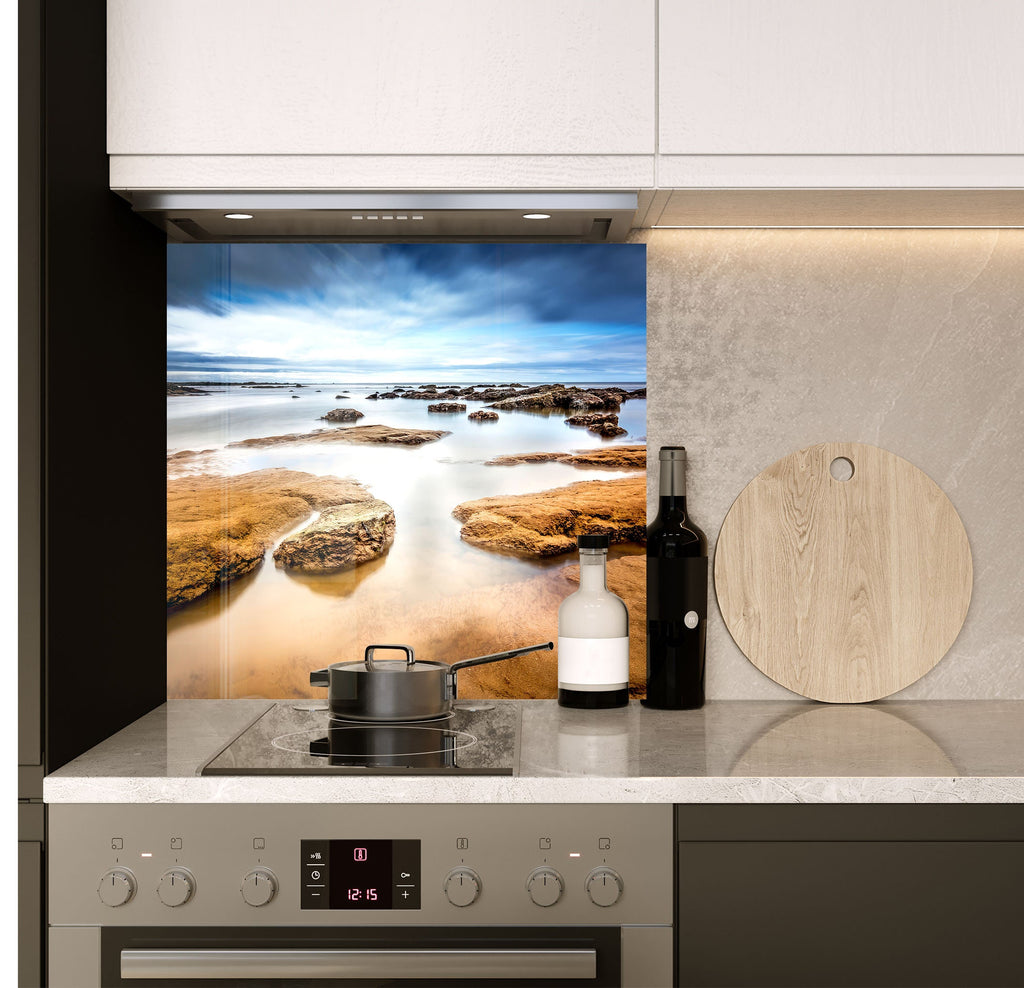 a stove top oven sitting inside of a kitchen